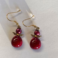 Røde øreringe med...