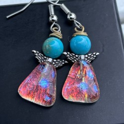 Blå lyse øreringe med et...